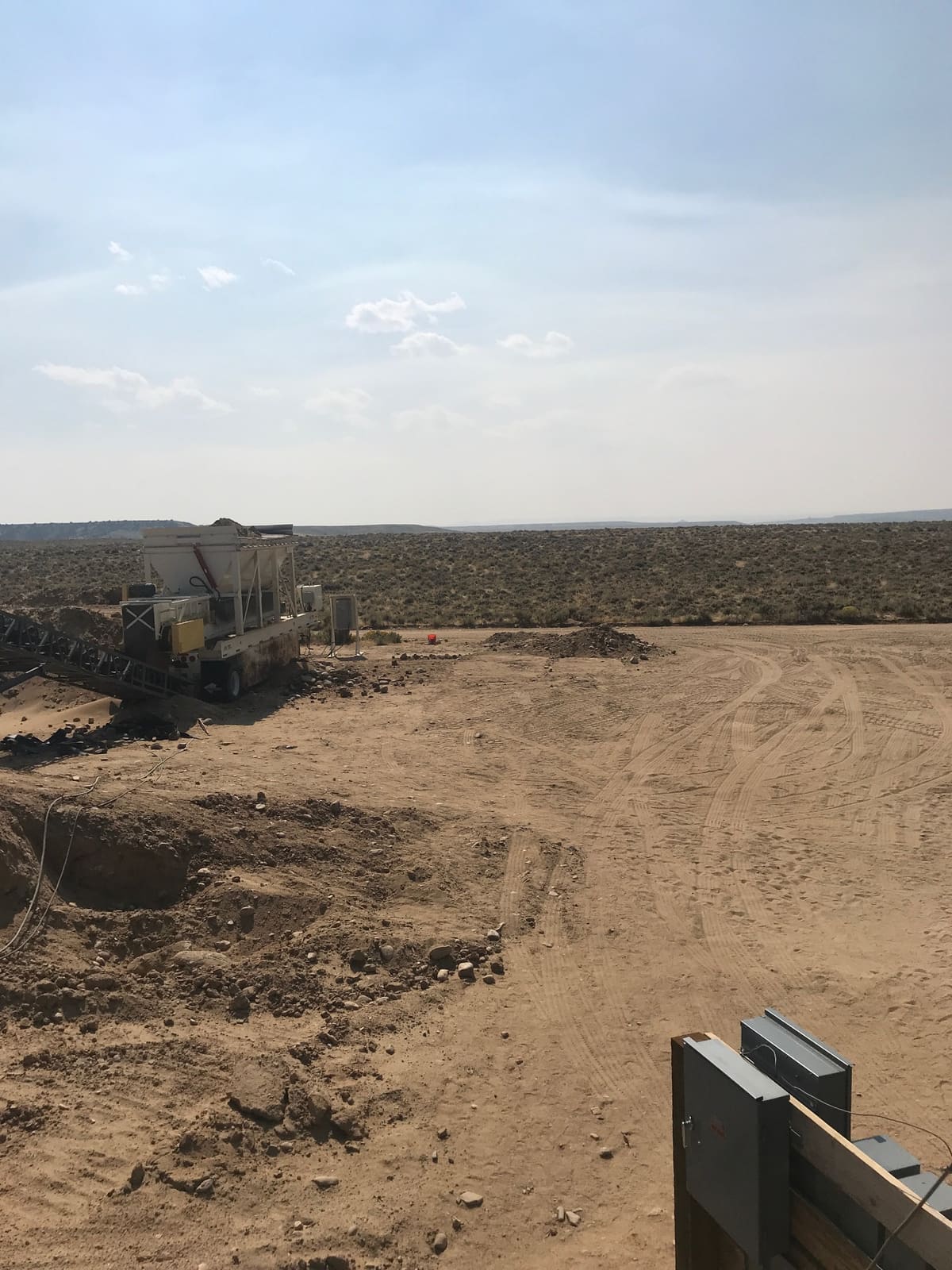 A dry wash plant line running in open high-desert country.